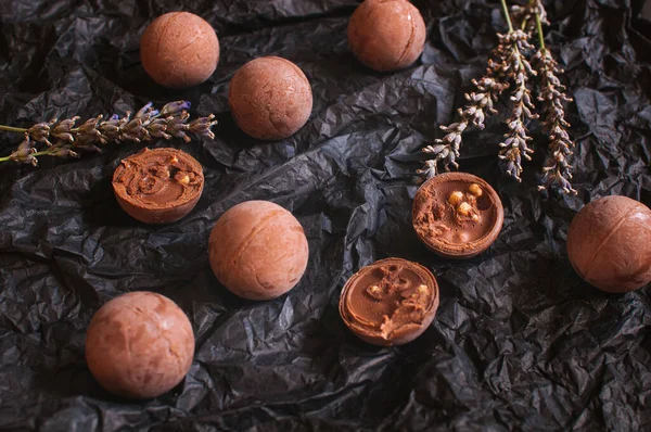 Chocolate Candies Dark Crumpled Craft Paper Lavender Flowers — Stockfoto