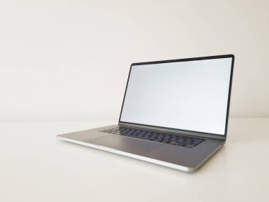 laptop on white table front view