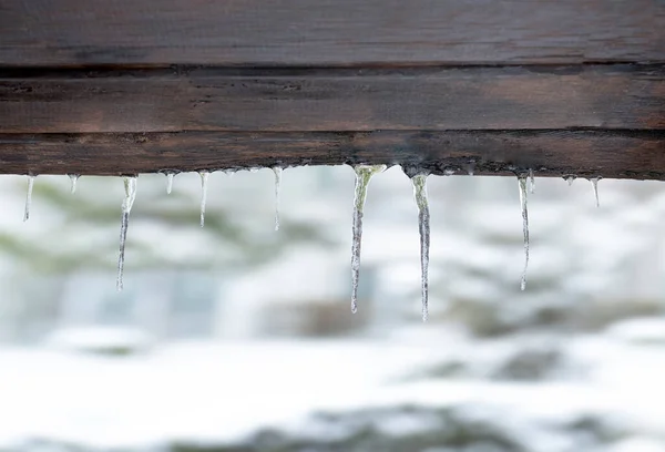 Small Icicles Wooden Background — Stock Photo, Image