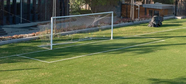 empty soccer field, empty goal