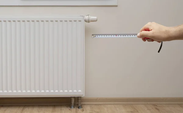 Hand Holding Meter Modern White Radiator Thermostat Background — Stockfoto