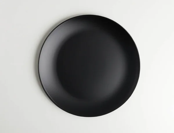 Schwarze Platte Auf Isoliertem Weißem Hintergrund Ansicht Von Oben — Stockfoto