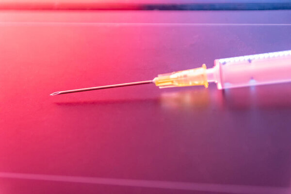 New medical vaccines ready for injection with syringe and vaccine to inject the cure for immunization into ill and weak patients to heal their suffers and illnesses supported corona health care system