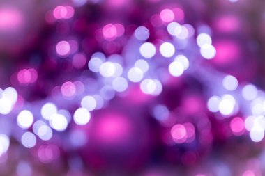 Şenlikli pembe gül ışıltılı bokeh Noel baloları arka planı, Noel için mükemmel arka plan olarak renkli noktalar gösteriyor, gümüşçüler, kutlamalar ve mutlu yeni yıl etkinlikleri ve güzel bulanık bir parti