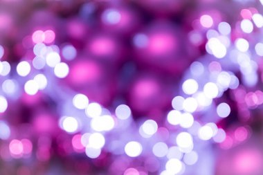 Şenlikli pembe gül ışıltılı bokeh Noel baloları arka planı, Noel için mükemmel arka plan olarak renkli noktalar gösteriyor, gümüşçüler, kutlamalar ve mutlu yeni yıl etkinlikleri ve güzel bulanık bir parti