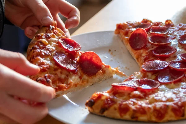 Child Hand Holding Piece Pizza Salami Hot Steam Delicious Cheese — Stock Photo, Image