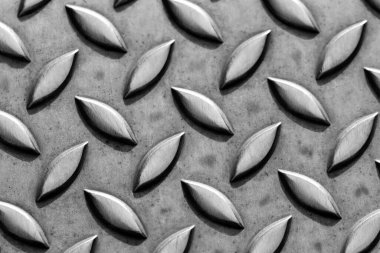 Som elmas metal plaka yüzeyi endüstriyel imalatta paslanmaz çelik döşeme gösteriyor. Metal merdivenler için steampunk arka plan ve ağır çelik plakalar korunmak için ve ağır zırhlı askeri araçlar için.