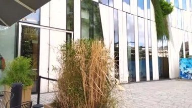 DUSSELDORF, GERMANY - July 14th, 2022: Kbogen, modern Business Building in Dusseldorf, Germany with organic glass facade and visionary architecture with plants in the facade elegant building facades
