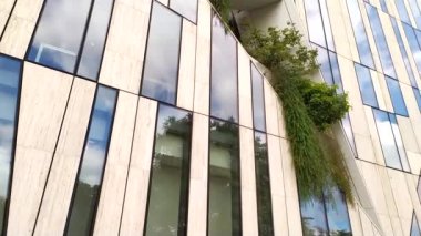DUSSELDORF, GERMANY - July 14th, 2022: Kbogen, modern Business Building in Dusseldorf, Germany with organic glass facade and visionary architecture with plants in the facade elegant building facades