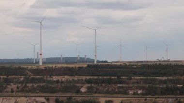 Neuss, Germany - 07 31 2022: Garzweiler brown coal and open pit mine for ignite shows natural disaster of surface mining and exploitation of fossil energy with heavy machinery like excavators diggers