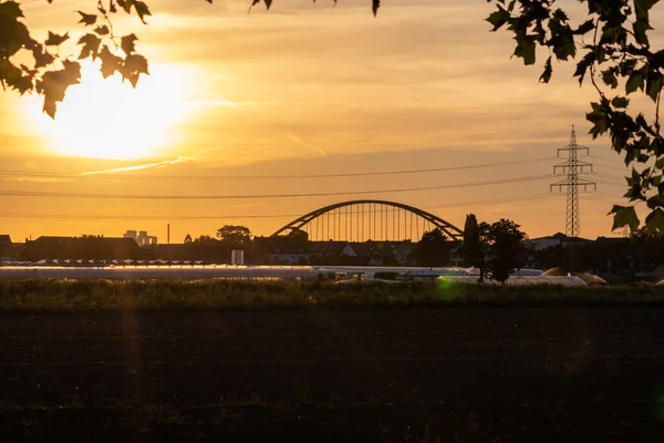 Golden Sunset Greenhouse Silhouettes Bridge Electricity Tower Solar Power Agricultural — Foto de Stock