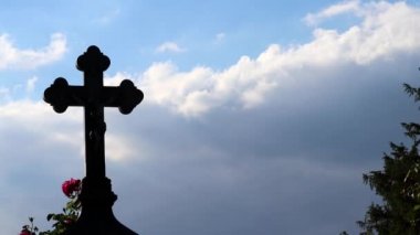 Holy cross on grave as religious symbol for death faith belief christianity jesus christ and god on old cemetery for memorial to dead family members buried in a tomb on their way to heaven and god
