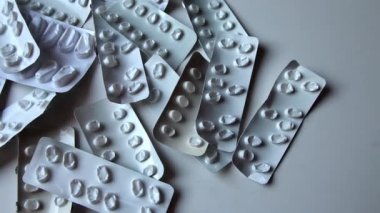 Many empty pill packages blisters of drug addicted people and drug abusing people as pharmaceutical painkiller and medical therapy overdose treatment for medical addicted people and dangerous overdose