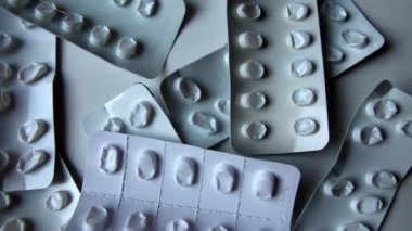 Many empty pill packages blisters of drug addicted people and drug abusing people as pharmaceutical painkiller and medical therapy overdose treatment for medical addicted people and dangerous overdose