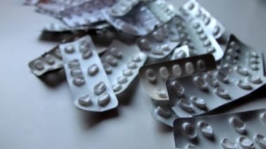 Many empty pill packages blisters of drug addicted people and drug abusing people as pharmaceutical painkiller and medical therapy overdose treatment for medical addicted people and dangerous overdose
