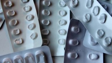 Many empty pill packages blisters of drug addicted people and drug abusing people as pharmaceutical painkiller and medical therapy overdose treatment for medical addicted people and dangerous overdose