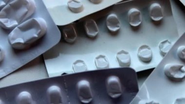 Many empty pill packages blisters of drug addicted people and drug abusing people as pharmaceutical painkiller and medical therapy overdose treatment for medical addicted people and dangerous overdose