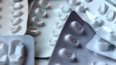 Many empty pill packages blisters of drug addicted people and drug abusing people as pharmaceutical painkiller and medical therapy overdose treatment for medical addicted people and dangerous overdose