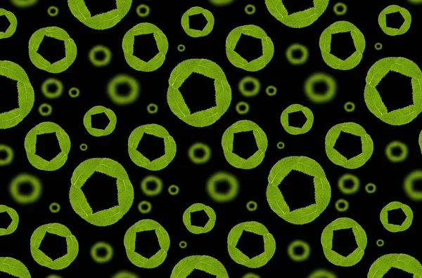 Seamless pattern with circles of leaves on black.