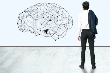 Beynin duvarına bakan bir adam