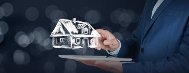 Ekranda ev ağı olan adam el tableti