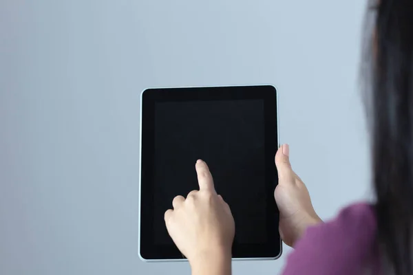 young woman hand holding tablet