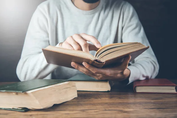 Man Reading Book Wooden Desk — Foto Stock