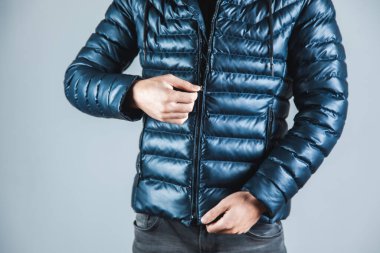 man hand  jacket on gray background