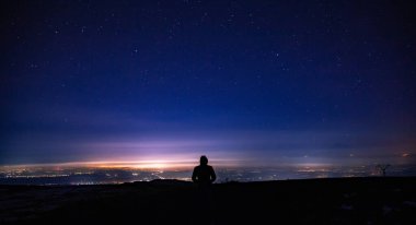 man in high under the stars background