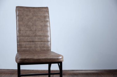 Brown leather chair in studio