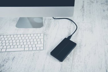 black HDD on the wooden desk background