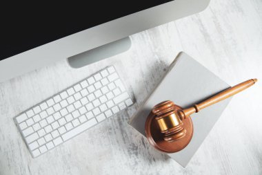 judge on book with computer on desk