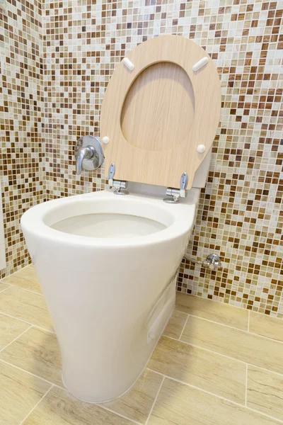 Toilet with wooden cover — Stock Photo, Image