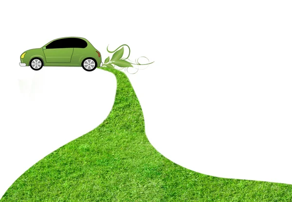 Eco car on white background with grass track behind it — Stock Photo, Image