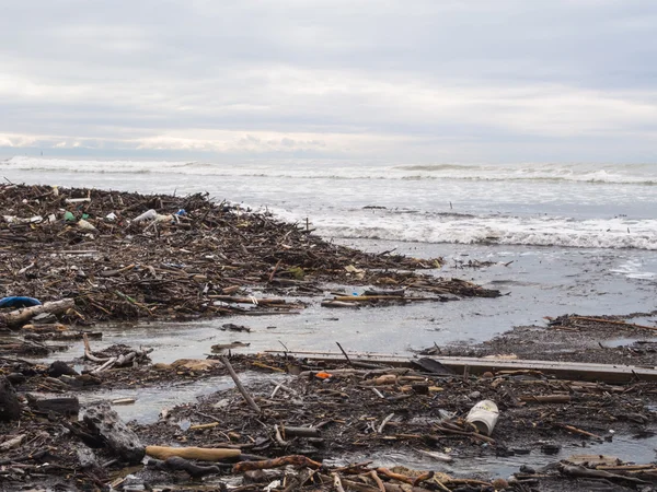 Dirty beach - pollution along the beach — Stock Photo, Image