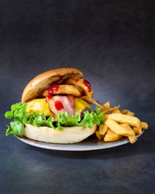 hamburger with french fries on chalkboard background