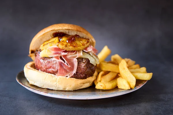 hamburger with french fries on chalkboard background