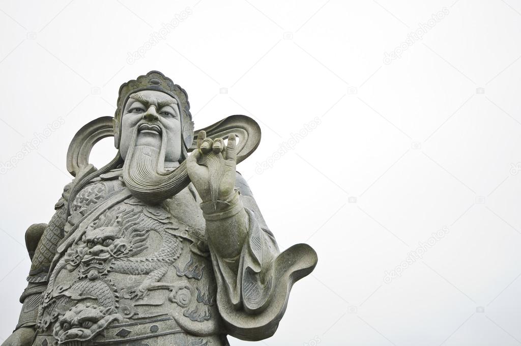 Chinese god ancient stone statue isolated