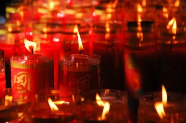 red candle light in asian temple