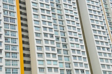 High-rise residential  flat white apartments with some windows open