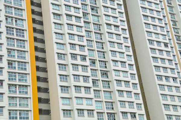 High-rise residential  flat white apartments with some windows open