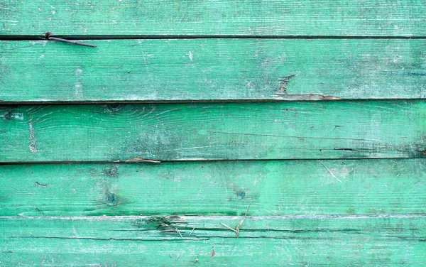 Eski arkaplan olarak grunge biçiminde yeşil çit dokusu 