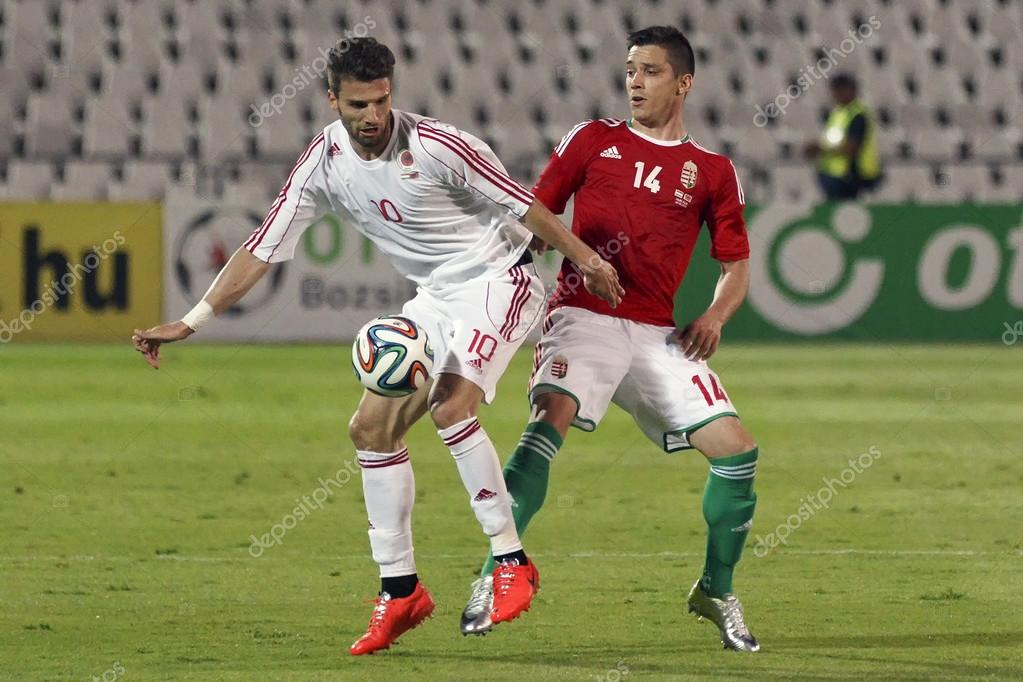 BUDAPEST, HUNGARY - APRIL 13, 2016: Gabor Gyomber Of Ferencvaros (l) Shots  On Target Next To Norbert Meszaros Of DVSC During Ferencvaros - DVSC  Hungarian Cup Semi-final Football Match At Groupama Arena.