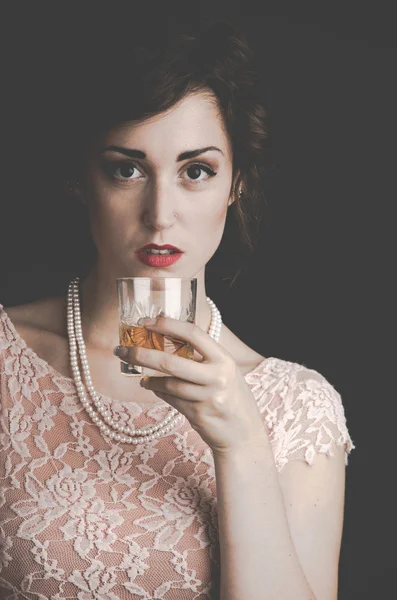Vintage portrait of woman holding a drink