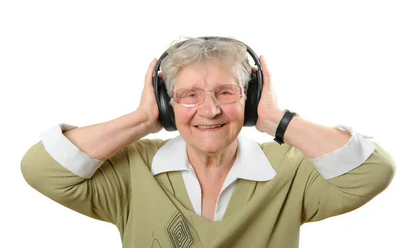 Kulaklık yaşça daha büyük kadınla — Stok fotoğraf