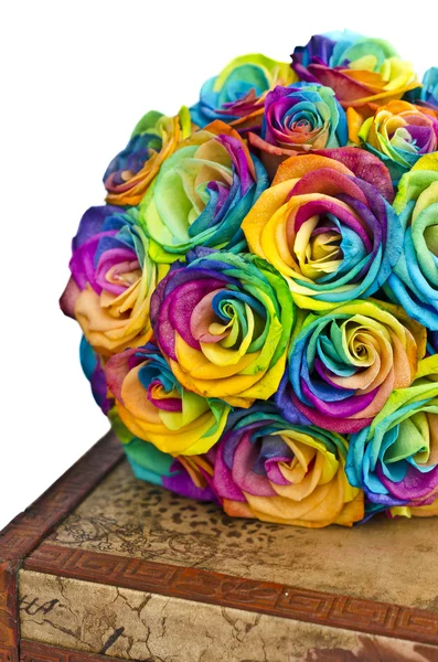 Rainbow roses bouquet on box — Stock Photo, Image