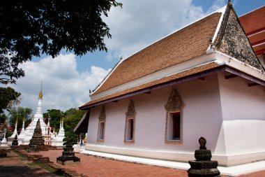 Ancient old ordination hall or antique ubosot church and ruins stupa chedi for thai people visit respect praying blessing holy worship at Wat Chomphuwek or Chumpoo Wek temple in Nonthaburi, Thailand
