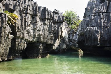 View landscape rock stone of Prasat Hin Pan Yod island beach in sea or ocean of Ko Khao Yai in Mu Ko Petra National Park for thai people travelers travel visit in Pak Bara at La ngu of Satun, Thailand