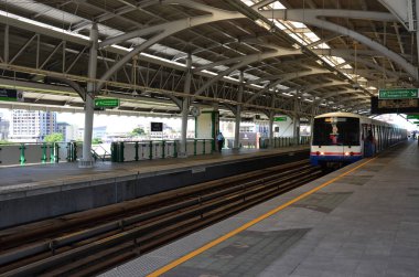 View landscape cityscape of bangkok city and building BTS skytrain running send and receive thai passenger people and foreign traveler journey at Bang Na station on July 5, 2014 in Bangkok, Thailand