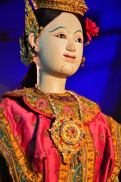 Ancient puppets toy or antique marionette thai style for playing acting on stage show thai people and foreign travelers travel visit festival event fair in night time at Sam Yan in Bangkok, Thailand